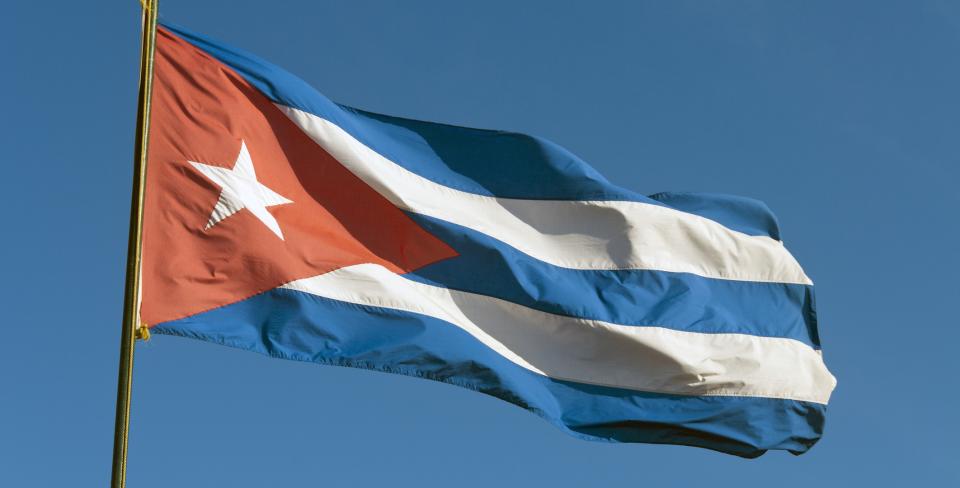 Cuba flag The Cuban flag waving against a clear blue sky.